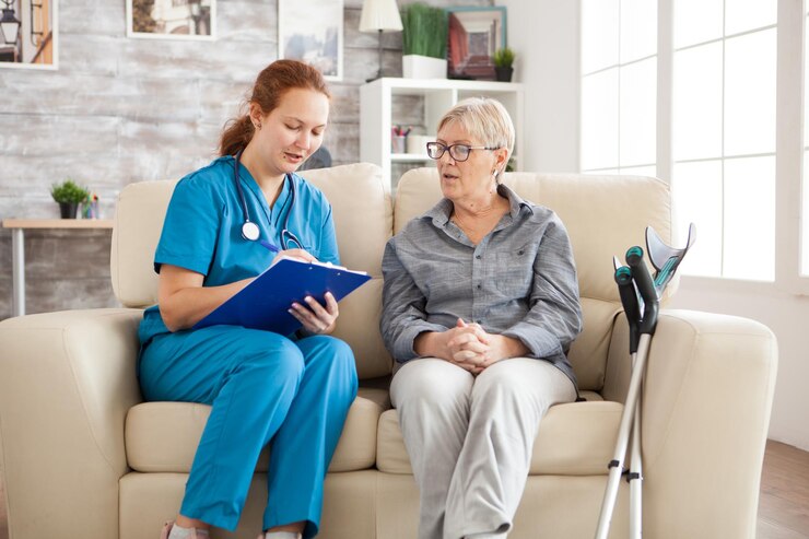 female-doctor-nursing-home-doing-survey-senior-woman-with-crutches_482257-45169